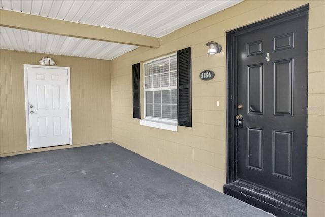 doorway to property featuring a porch