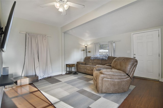 living room with hardwood / wood-style floors, beamed ceiling, and ceiling fan