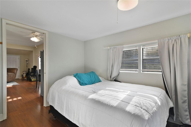 bedroom featuring dark wood-type flooring and ceiling fan