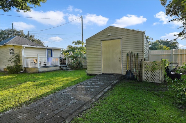 view of outbuilding featuring a lawn