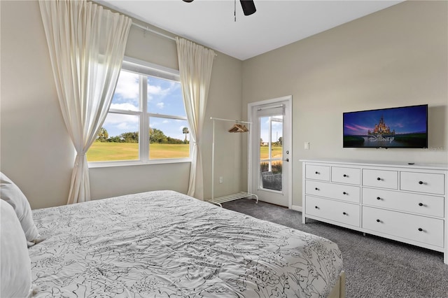 bedroom with dark colored carpet, ceiling fan, and access to outside