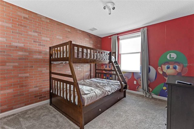 781 Ocean Course Ave Unit 601, Davenport, FL 33896 - carpeted bedroom featuring a textured ceiling and brick wall