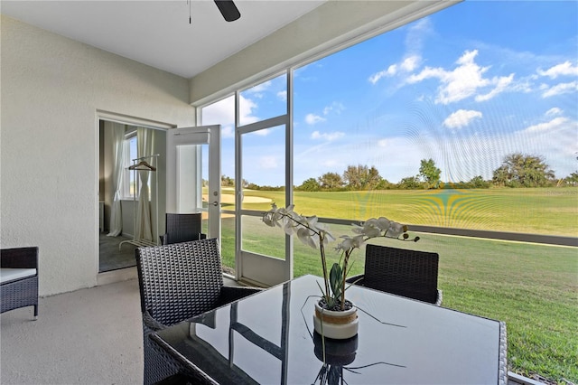 sunroom with ceiling fan and plenty of natural light