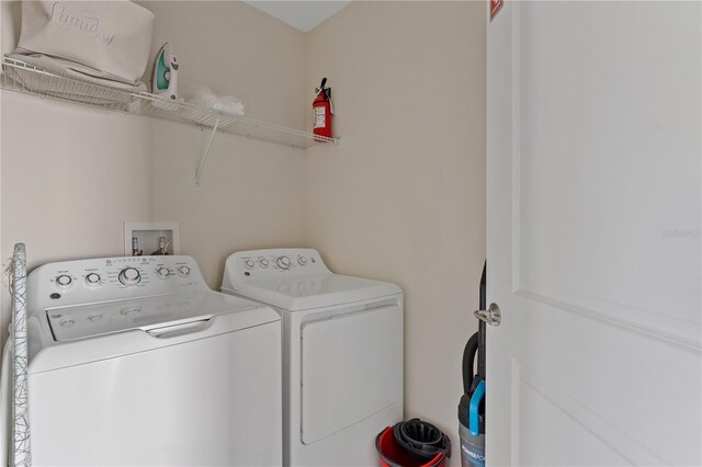 laundry area featuring independent washer and dryer