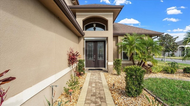 property entrance featuring french doors