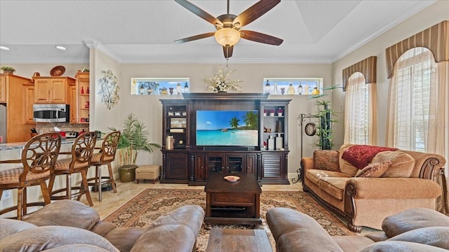 living room with ceiling fan, light tile patterned flooring, and ornamental molding