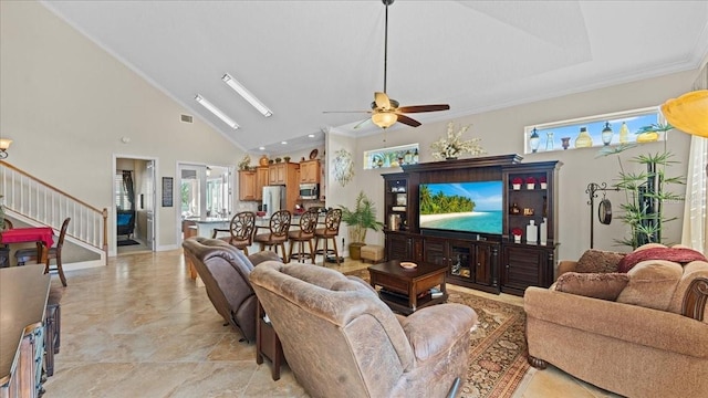 living room with high vaulted ceiling, ceiling fan, and crown molding