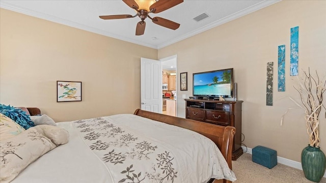 carpeted bedroom with ceiling fan and ornamental molding