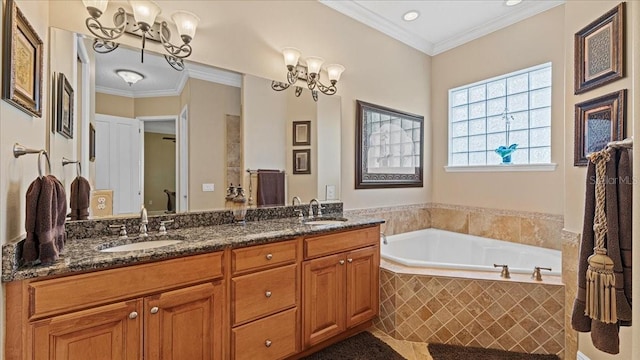 bathroom with tiled bath, vanity, and ornamental molding