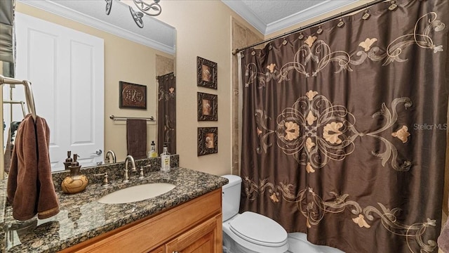 bathroom featuring vanity, crown molding, toilet, a textured ceiling, and walk in shower