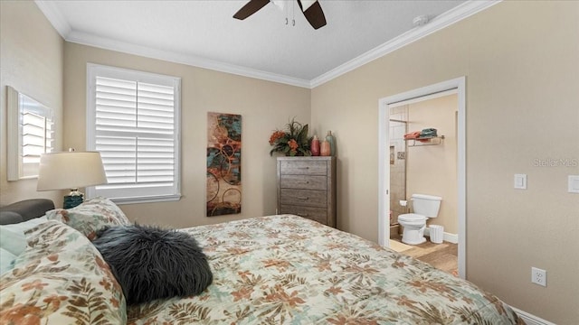 bedroom featuring light hardwood / wood-style floors, ceiling fan, a spacious closet, and ornamental molding