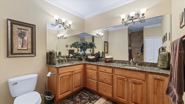 bathroom with vanity, toilet, ornamental molding, and an inviting chandelier