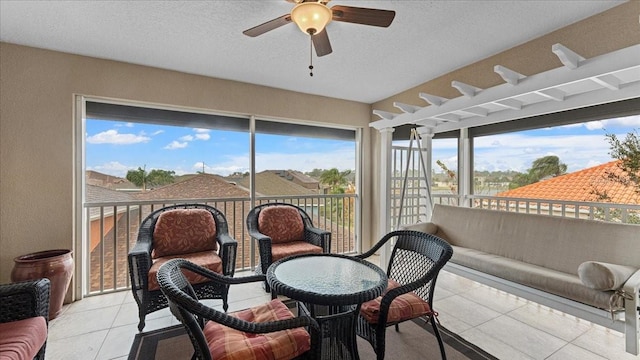 sunroom / solarium with ceiling fan