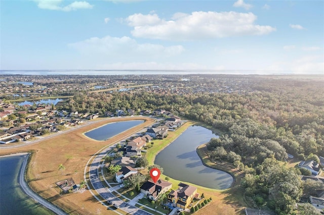 birds eye view of property with a water view