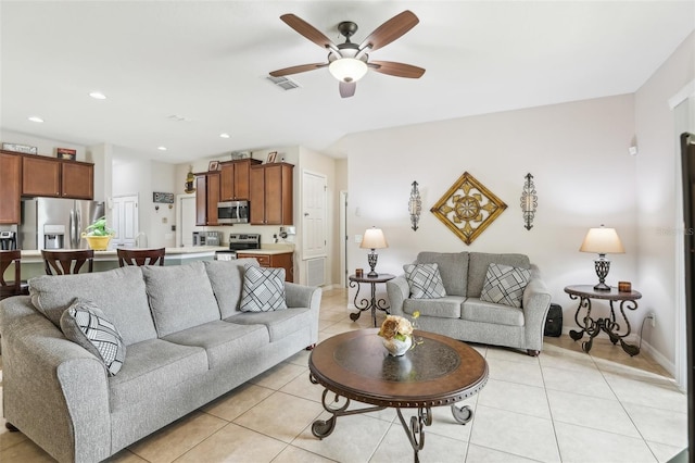 tiled living room featuring ceiling fan