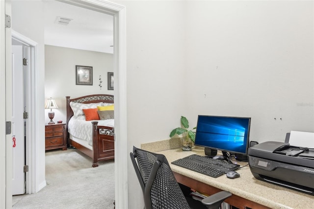 bedroom featuring light carpet