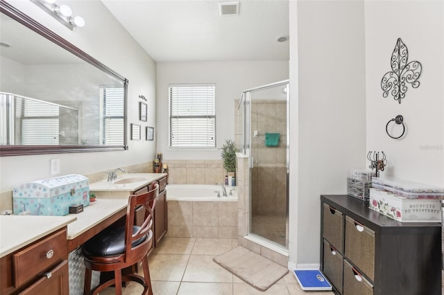 bathroom featuring vanity, separate shower and tub, and tile patterned floors