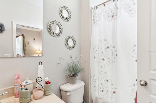 full bathroom with shower / bath combination with curtain, toilet, and sink