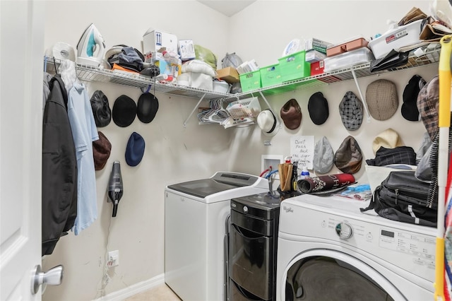 laundry room with washing machine and clothes dryer