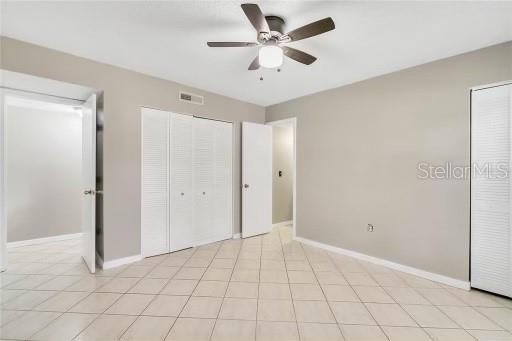 unfurnished bedroom with ceiling fan