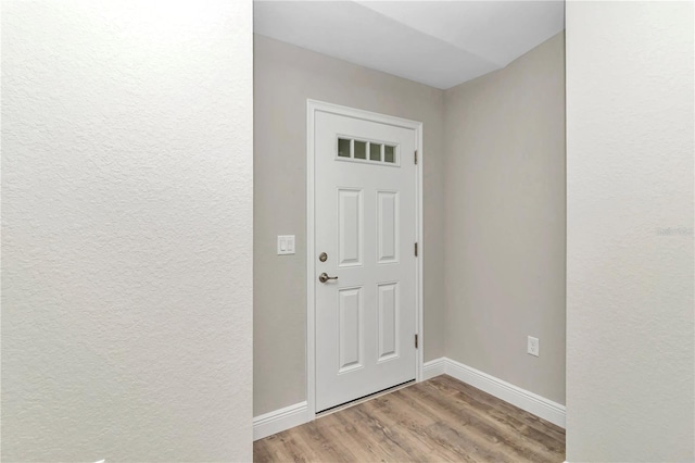 entryway with light hardwood / wood-style floors