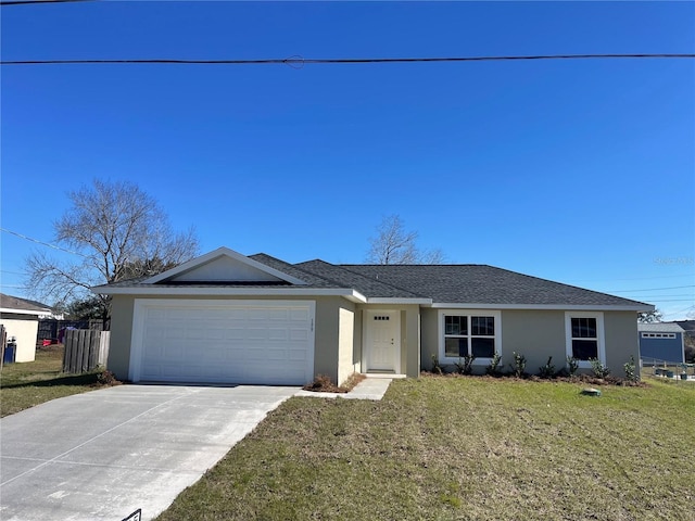 single story home featuring a garage and a front yard