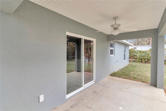 view of patio featuring ceiling fan