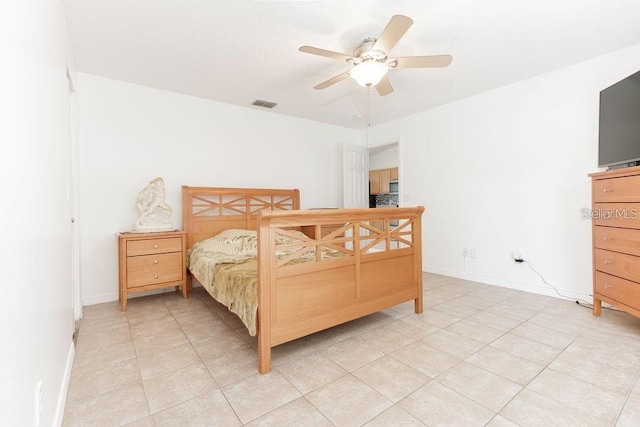 bedroom with ceiling fan and light tile patterned floors