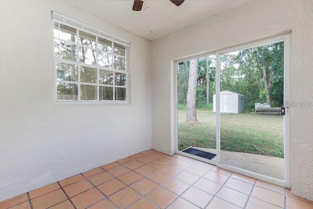 interior space featuring ceiling fan