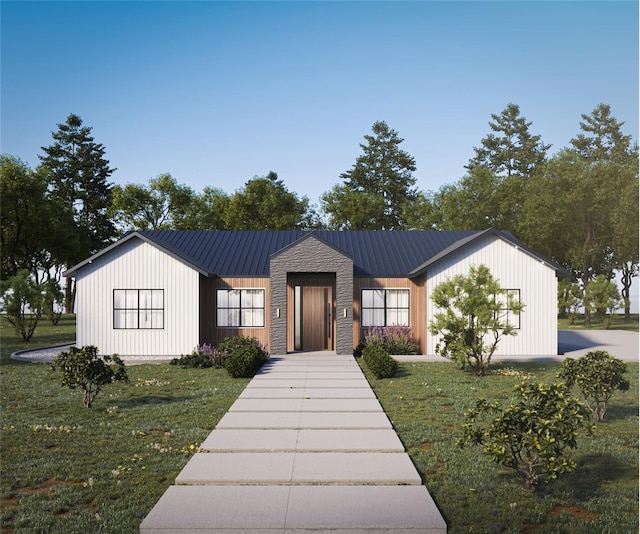 modern farmhouse style home with a front lawn