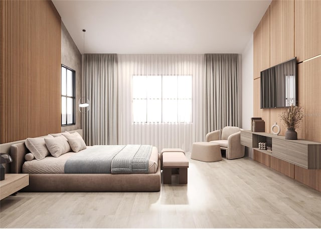 bedroom featuring multiple windows and light hardwood / wood-style flooring