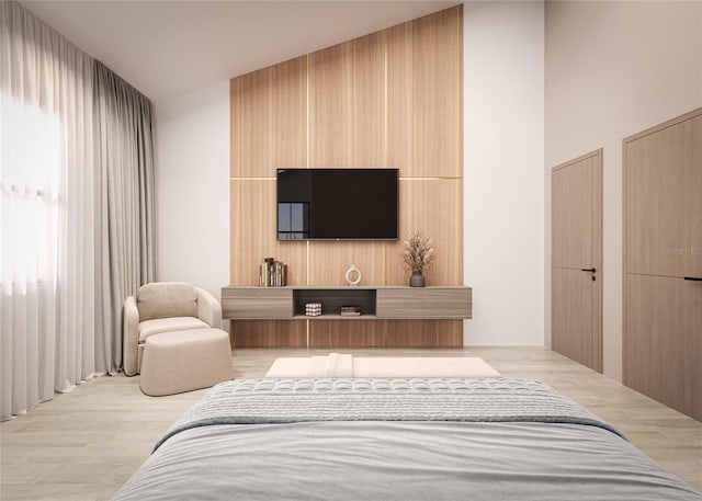 bedroom with light hardwood / wood-style flooring and lofted ceiling