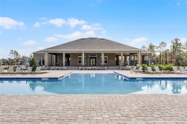 view of swimming pool featuring a patio area