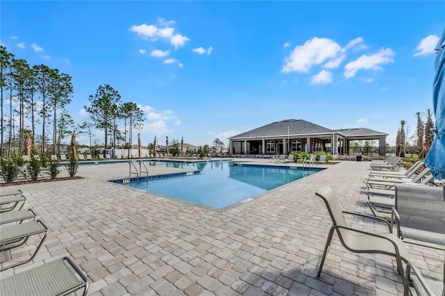 view of swimming pool featuring a patio area