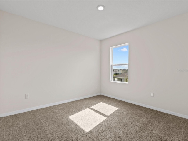 empty room featuring carpet floors