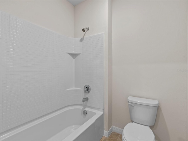 bathroom featuring tile patterned flooring,  shower combination, and toilet