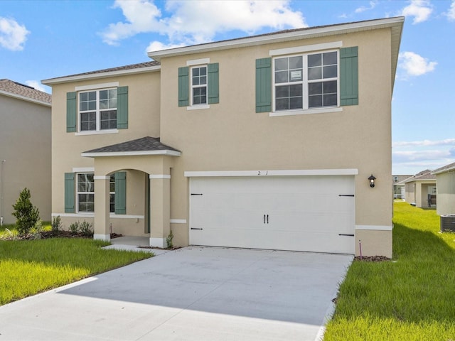 view of front facade featuring a front yard and a garage