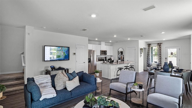 living room featuring dark hardwood / wood-style flooring