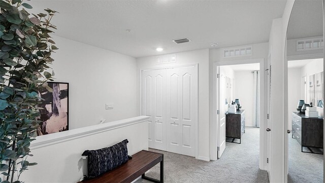 corridor with carpet floors