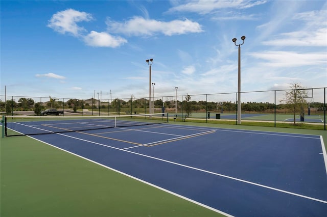 view of sport court featuring basketball hoop