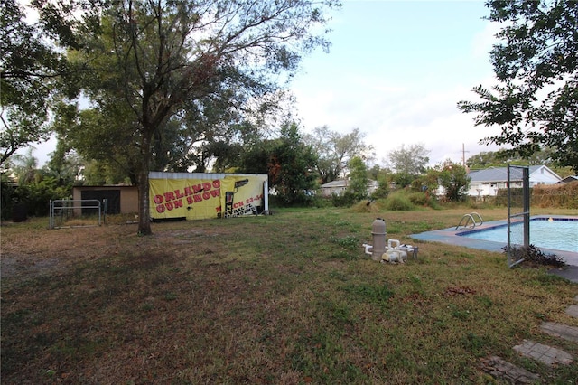 view of yard with an outdoor pool