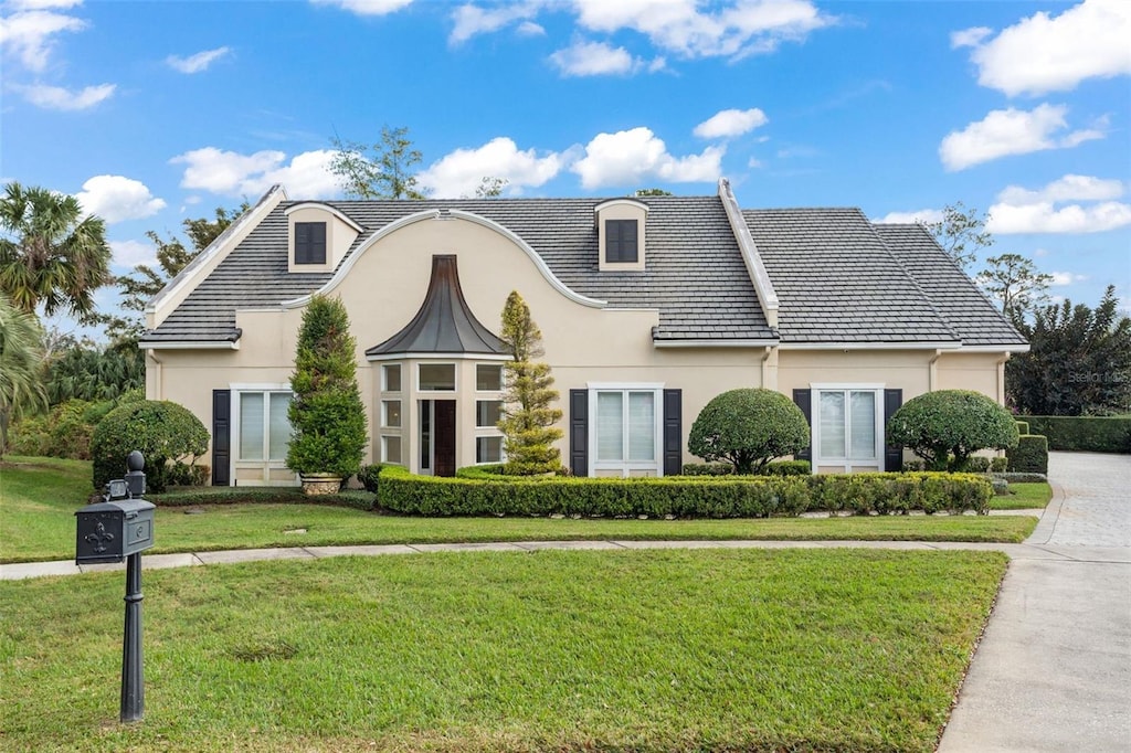 view of front of home with a front yard