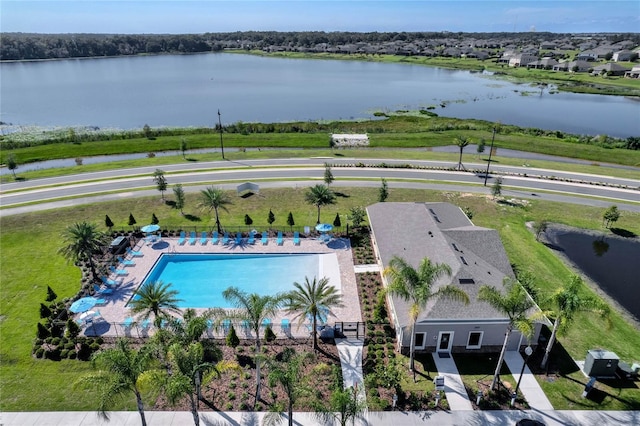 birds eye view of property with a water view