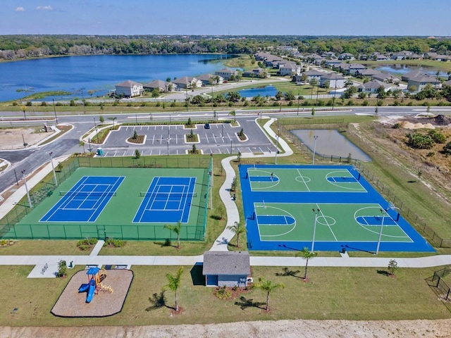 birds eye view of property with a water view