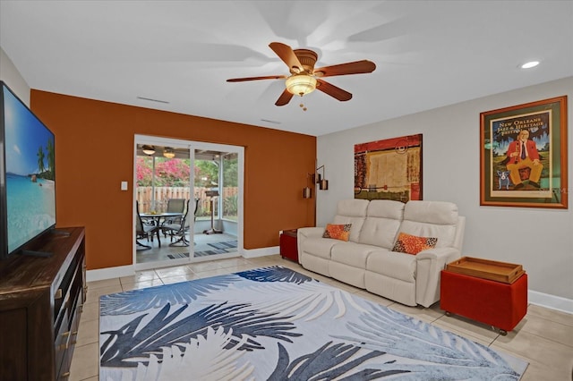 tiled living room featuring ceiling fan