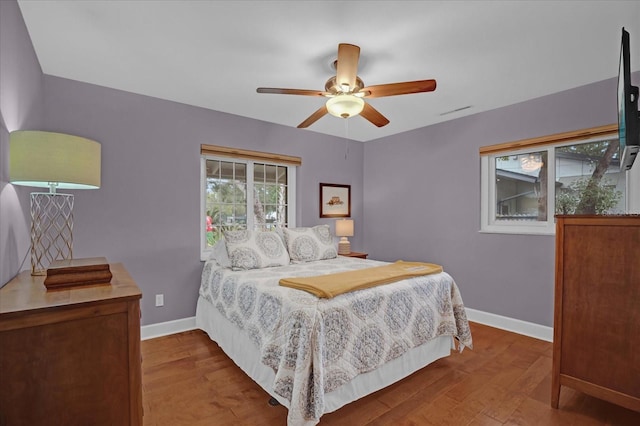 bedroom with hardwood / wood-style flooring and ceiling fan