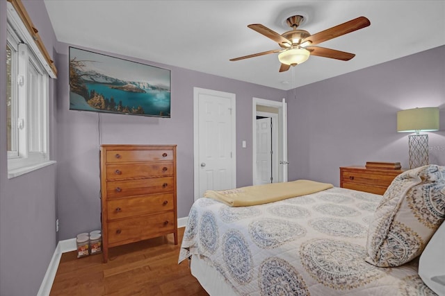 bedroom featuring hardwood / wood-style floors and ceiling fan