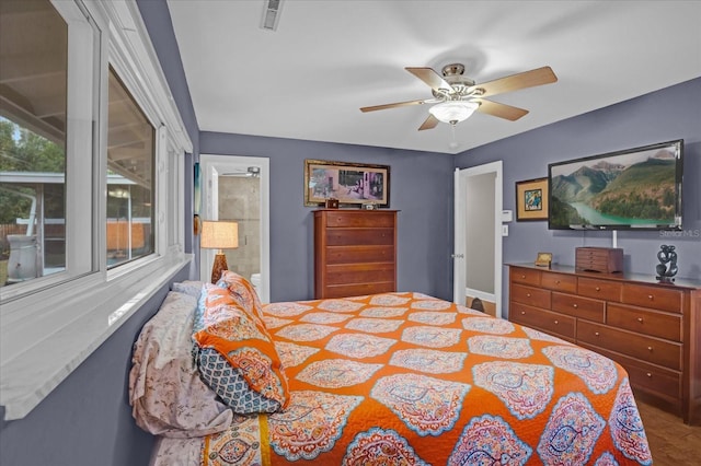 bedroom featuring ceiling fan and ensuite bathroom