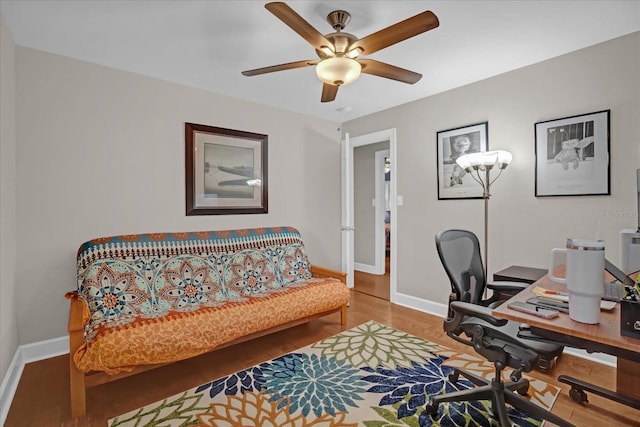 office with hardwood / wood-style flooring and ceiling fan