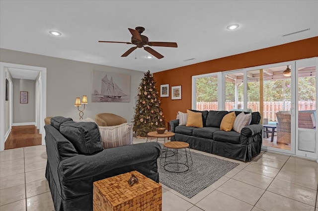 tiled living room featuring ceiling fan